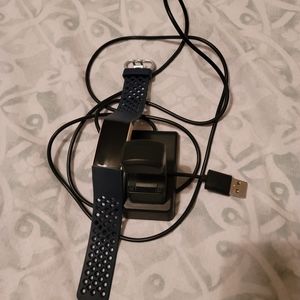 Fitbit Charge 3 with sport band and a charger